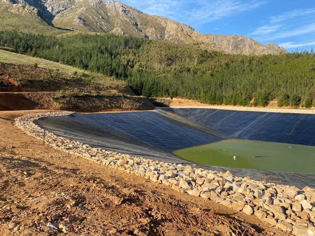 Large HDPE dam lining installation for water storage in Grabouw